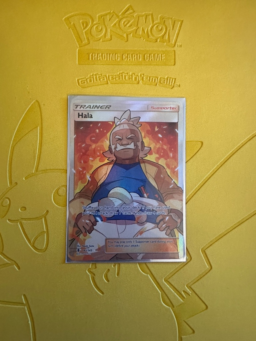 Hala Trainer Supporter Pokémon Card - Yellow/Orange Artwork
